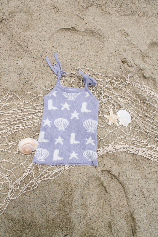 Coastal cowgirl lavender knit dress on the beach for toddler girls 